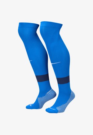 Calze compressive blu con texture a coste, caratterizzate da strisce orizzontali blu scuro e una zona del piede decorata con dettagli chiari.