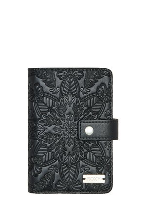 Black wallet with embossed floral pattern, magnetic snap closure, and a metallic "ROXY" plate. Compact rectangular shape with textured finish.