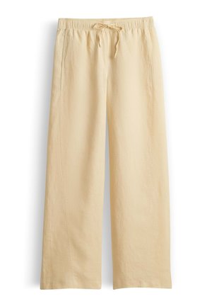 Pantalon beige à jambes larges avec taille élastique et cordon, fabriqué en tissu léger, adapté pour un port décontracté.