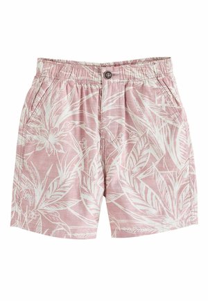 Pink cotton shorts with white tropical leaf and flower print, elastic waistband, button closure, and front side pockets.