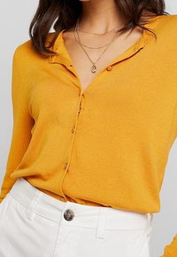 Dorothy Perkins Neuletakki - dark yellow