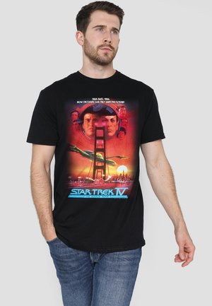 Black cotton t-shirt featuring a colorful graphic print of "Star Trek IV" with characters, a bridge, and sunset scenery.