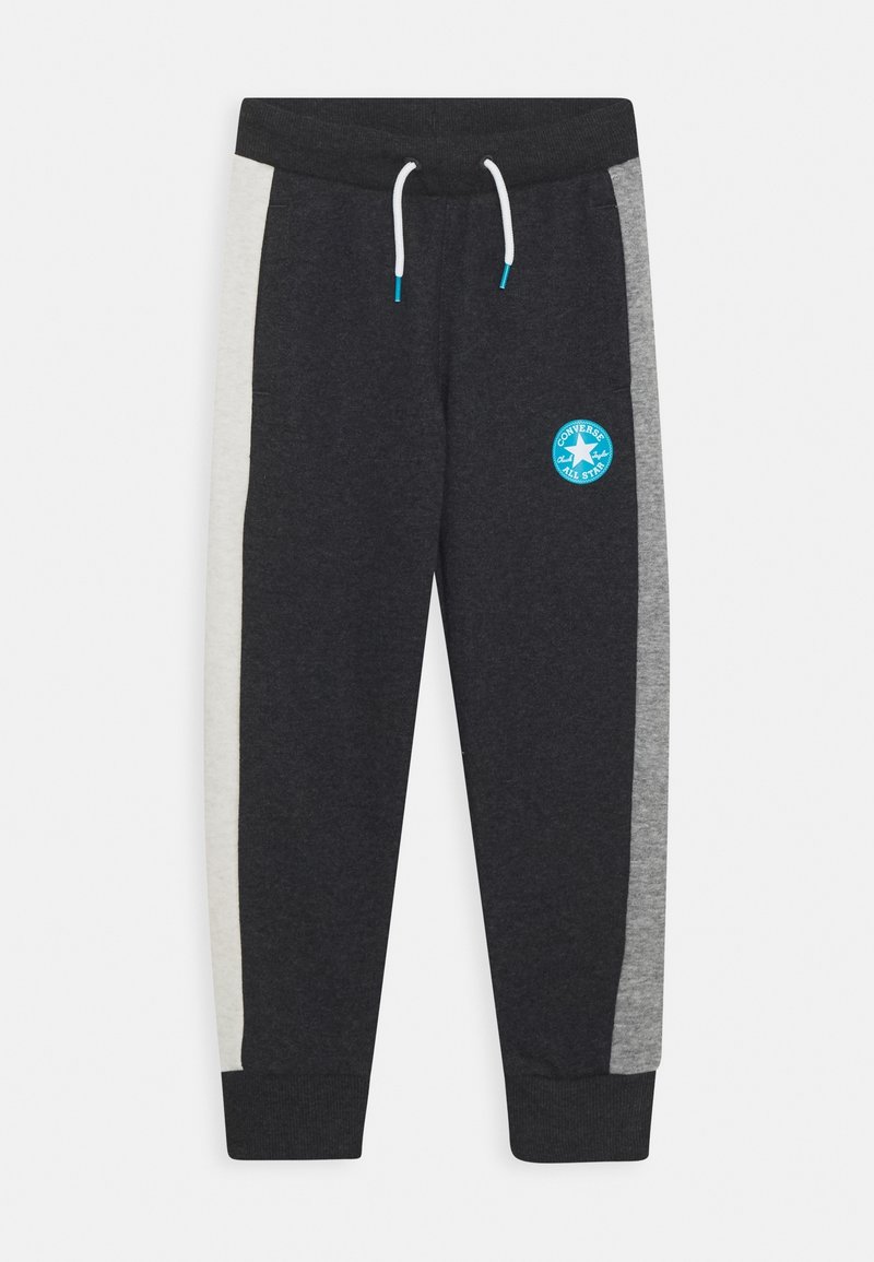 Dark gray jogger pants with light gray side panels, ribbed cuffs, white drawstring, and blue Converse All Star logo on the left thigh.