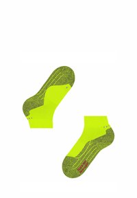 Helle neon-gelbe Socken mit kontrastierendem, gesprenkeltem grünen Muster, ausgestattet mit verstärkten Fersen- und Zehenbereichen. Branding an der Seite.