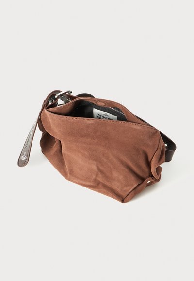 Brown suede bag with a structured shape, zipper closure, and leather strap. Displays a textured surface and is partially open.