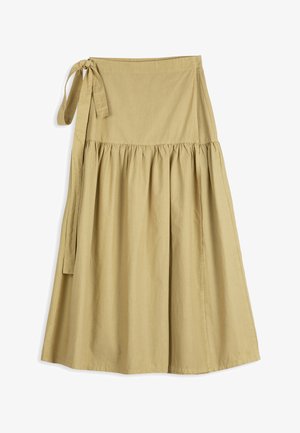 Jupe midi beige à nouer, taille froncée et fermeture latérale nouée, confectionnée dans un tissu léger.