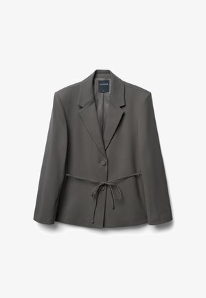 Gray, tailored blazer with a structured collar, a single button closure, and a tie waist detail. Smooth fabric with long sleeves and minimal accents.