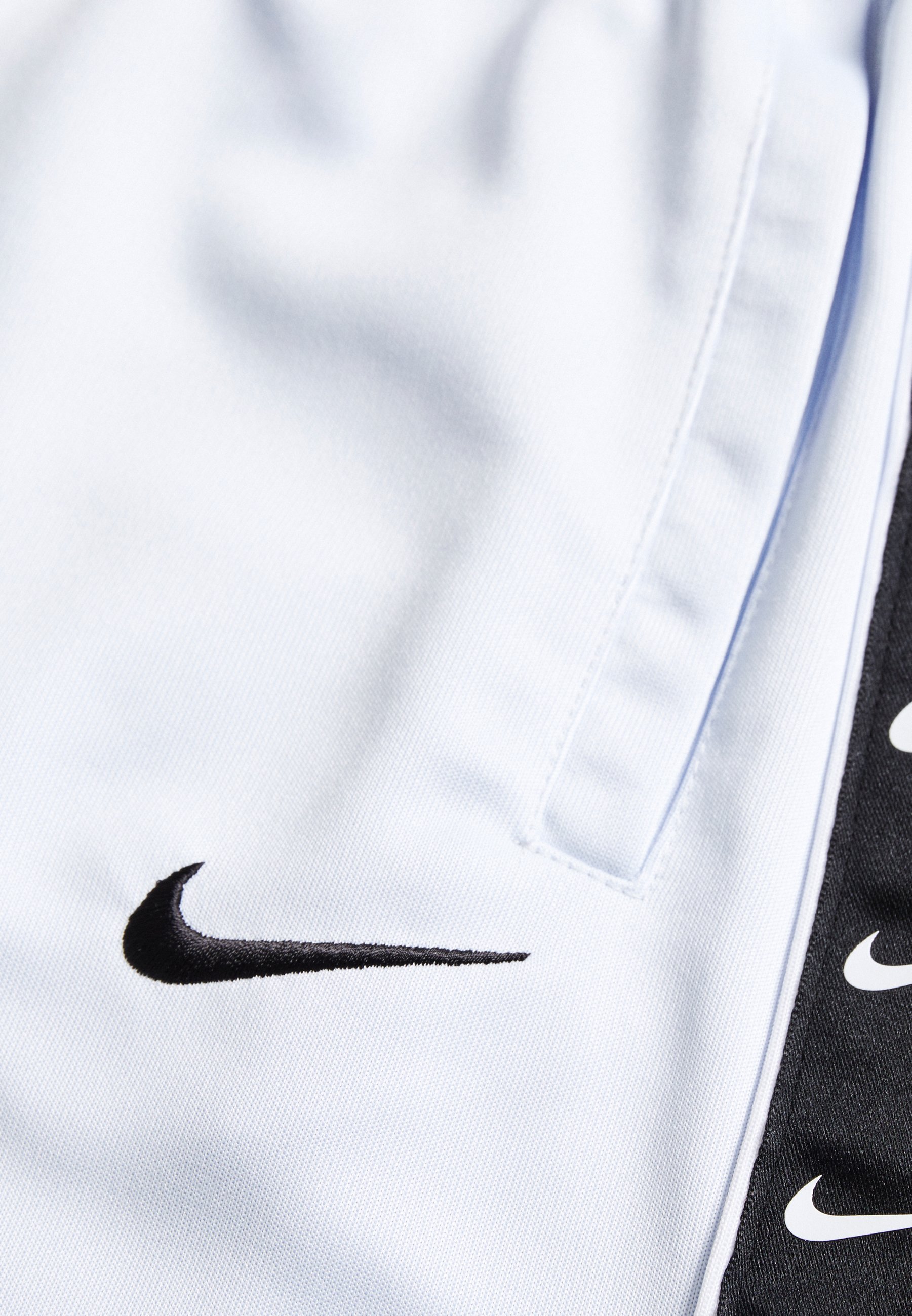 white nike tape shorts
