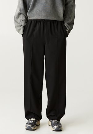JOGGERS - Housut - black