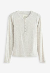 Dlouhý rukáv henley tričko v světlé šedé ribované tkanině. Má kulatý výstřih a pět kovových knoflíků na přední straně. Měkká textura.