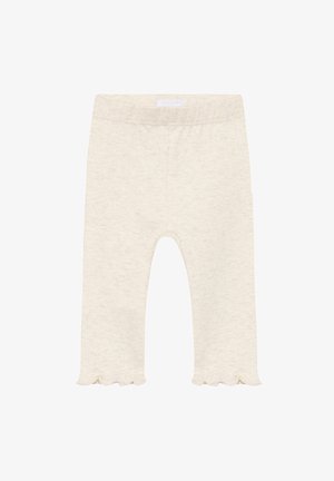 Roomkleurige legging gemaakt van zachte stof, met een geschulpte zoom, een elastische tailleband en een eenvoudig, naadloos ontwerp.