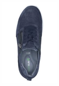 Navy blue suede sneaker featuring a zip closure, textured side panels, and a cushioned insole. White rubber sole with minimal design.