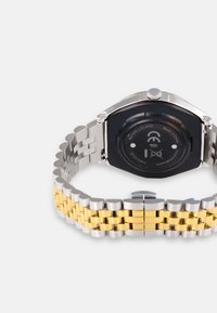 Stainless steel watch with a two-tone gold and silver link bracelet. Octagonal black case back with water-resistant markings and silver push crown.