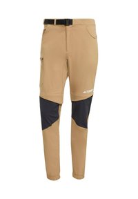 Khaki outdoor pants with black lower panels, featuring zip and open pockets, adjustable waistband, and elastic cuffs. Durable, lightweight design.