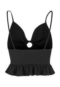 Black cropped top with a ribbed texture, plunging V-neck, and a central ring detail. Features thin straps and a ruffled hemline.