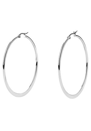 Large silver hoop earrings with a polished metal finish, featuring a smooth, circular design and a secure clasp closure.