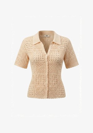 Beige gehaakt kort mouwtjestop met kraag, knoopsluiting aan de voorkant en een vierkant patroon in opengewerkt breiwerk.