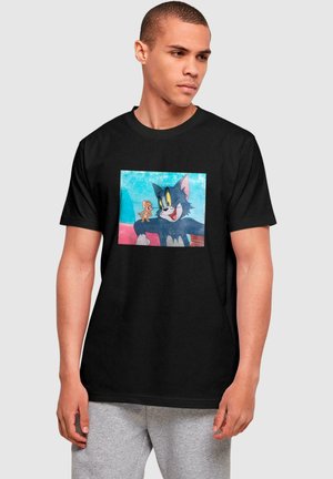 Black cotton t-shirt featuring a graphic of cartoon characters Tom and Jerry on a colored background, with short sleeves and a round neckline.