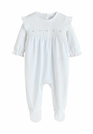 Hvid baby romper med korte rynkede ærmer, smocket brystdetalje og foddesign; fastgjort med knapper bagpå og sløjfede detaljer på fødderne.