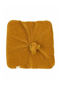 Pătură moale, de culoare muștar, cu o cap de ursuleț umplut, rotunjit, în centrul său, având detalii faciale cusute și urechi rotunjite.