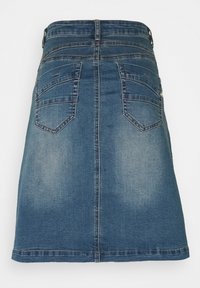 Denim skirt in medium blue with a straight cut. Features two back pockets, belt loops, and faded texture. Sewn hem at the bottom.