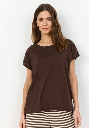 Brown cotton t-shirt with short rolled sleeves, rounded neckline, and relaxed fit. Paired with striped brown and cream pants.