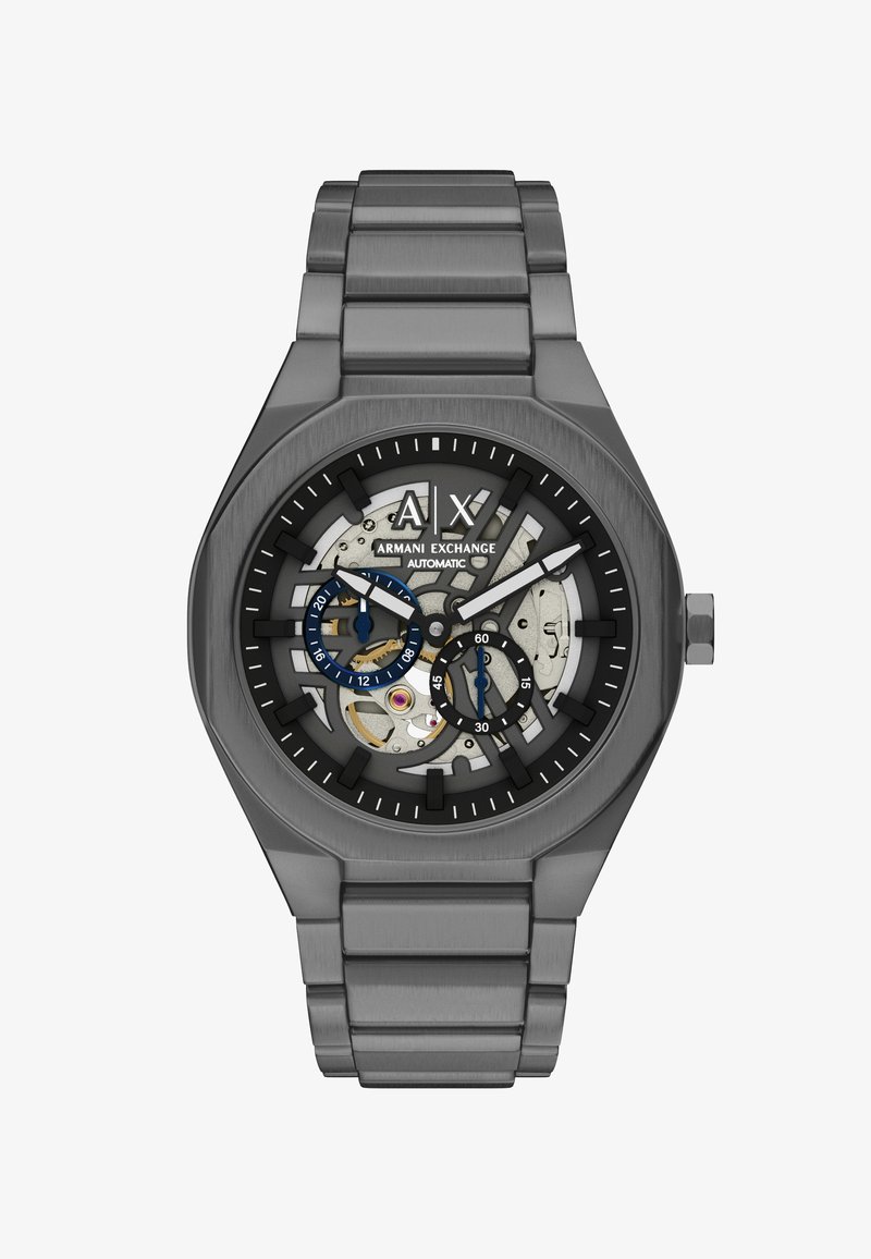 Gunmetal grå Armani Exchange automatisk ur med skelet urværk, blå og sorte subdials og metal link armbånd.