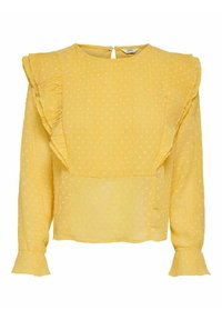 Gelbe Bluse mit Pünktchen, Rüschensäumen und Rundhalsausschnitt. Weicher, leichter Stoff mit einem dezenten strukturierten Muster und einem Knopfverschluss hinten.