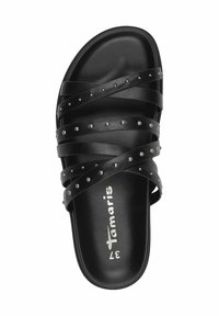 Black slide sandal featuring multiple cross straps with silver studs, smooth synthetic material, and a textured footbed with brand logo.