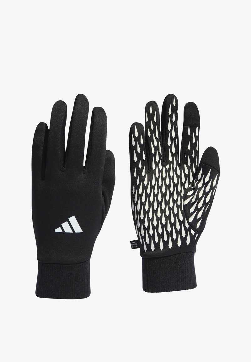 Black gloves featuring a white patterned grip on the palms, made from a stretchy fabric with a snug cuff. Includes Adidas logo on wrist.