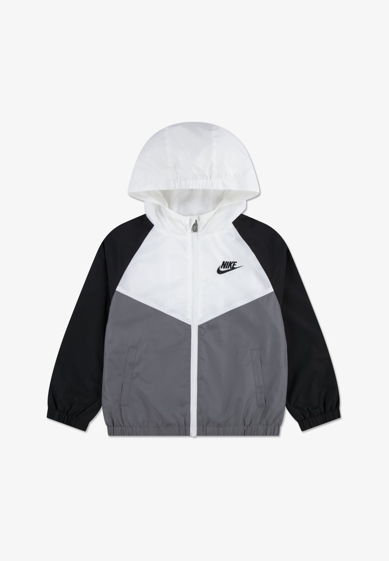 Αδιάβροχο μπουφάν Nike με πάνελ σε λευκό, γκρι και μαύρο, κουκούλα, κλείσιμο με φερμουάρ και ελαστικά μανίκια για άνετη εφαρμογή.