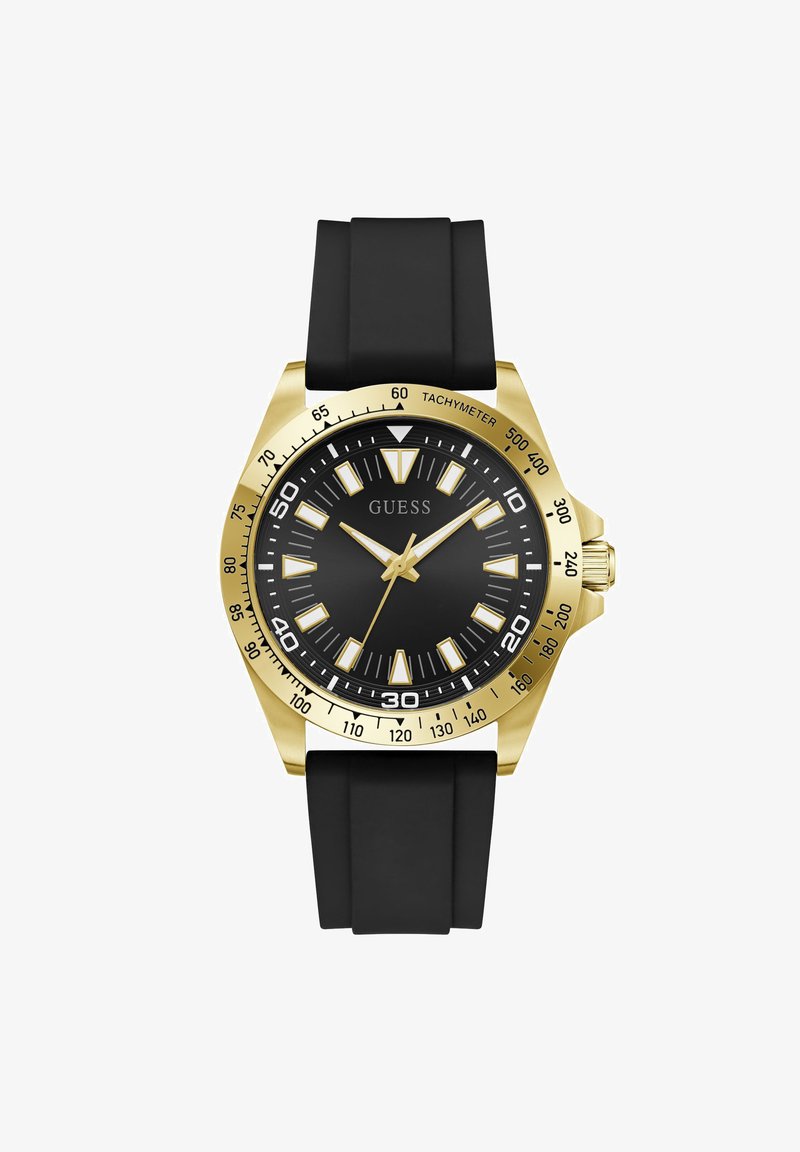 Montre-bracelet ton or avec cadran noir, marqueurs d'heure blancs et dorés, bracelet en silicone noir et échelle tachymétrique sur la lunette.