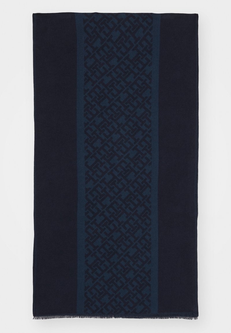 Écharpe bleu marine foncé avec une bande centrale verticale présentant un motif géométrique ton sur ton et des bords frangés.