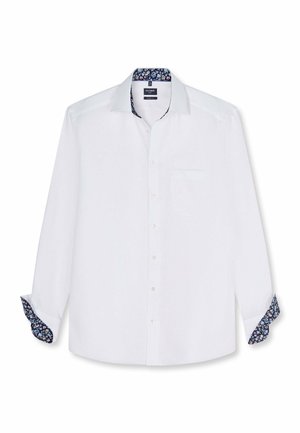 Camicia bianca a maniche lunghe con bottoni, con dettagli floreali blu navy all'interno del colletto e dei polsini, tasca frontale e orlo dritto.