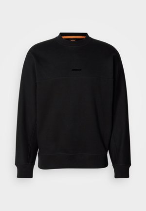 Black cotton sweatshirt with a crew neck, featuring a horizontal seam and subtle embossed logo. Ribbed cuffs and hem provide structure.
