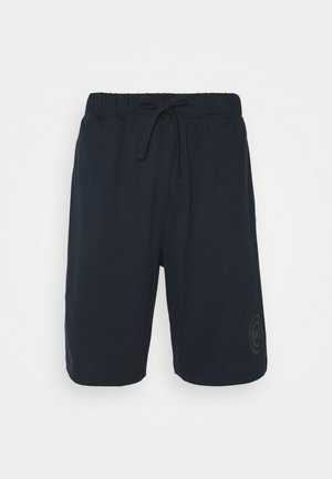 Navy blue shorts made of soft cotton blend, featuring an elastic waistband with drawstring and a logo patch on the left leg.