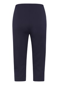 Navy ankle-length pants made of smooth, stretchy fabric with a fitted design and an elastic waistband. No pockets or visible hardware.