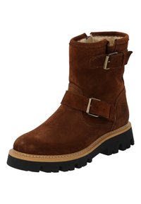 Stivale alla caviglia in suede marrone con punta rotonda, fodera in pelliccia sintetica e due cinturini regolabili con fibbie metalliche. Suola in gomma nera spessa.