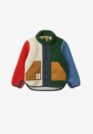 Colorful fleece jacket with red, green, blue, and cream sections, featuring tan pockets and a high collar. Zipper front and plush texture.