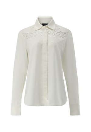 Weißes Langarmhemd mit Button-Down-Kragen, das über ein aufwendiges gesticktes Detail auf der Brust und eine glatte Stofftextur verfügt.