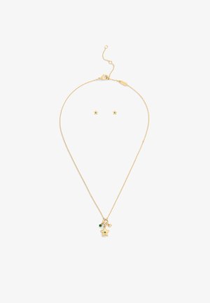 Collana oro con pendente a stella e accento verde, abbinata a orecchini a bottone a stella coordina. Catena con chiusura regolabile.