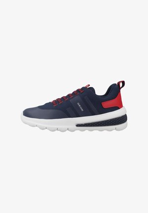 Navy mesh athletic shoe with red accents and laces, white sole, textured heel, branded side, and smooth toe cap.