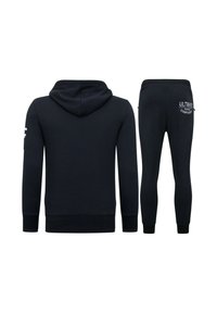 Navy blauw hoodie- en joggingset. De hoodie heeft een capuchon en geribde manchetten; de joggers zijn aangesloten en hebben logotekst op de achterkant. Gemaakt van een katoenmix.