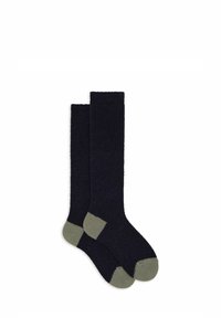 Calzini blu navy fino al ginocchio con una consistenza morbida, caratterizzati da accenti verde chiaro su punta e tallone. Design semplice e senza cuciture.
