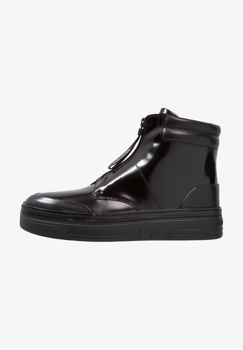 Black high-top sneakers with a glossy finish, zip closure, thick sole, and rounded toe. Features minimalistic design and textured accents.