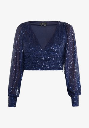 Navy blue cropped top with long puffed sleeves, covered in sequins, featuring a deep V-neck and textured body with gathered detailing.
