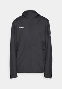 Giacca nera impermeabile con cappuccio, zip frontale completa e polsini regolabili. Presenta il logo "Mammut" sul lato sinistro del petto e tasche laterali con zip.