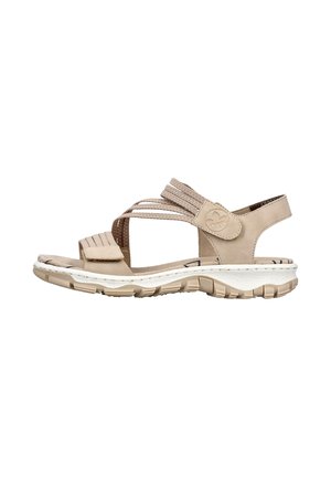 Sandalo casual beige con cinturini regolabili, suola imbottita e suola esterna texturizzata progettati per il comfort e il supporto.