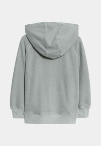 Hoodie grigio chiaro con tessuto testurizzato, cappuccio e polsini e orlo a coste. La vista posteriore mostra un design pulito e minimale.