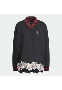 Musta huppari, jossa on V-pääntie, punaraidallinen kaulus ja kukkakirjailtu pitsireunus. Rinnassa Adidas-logo. Pitkät hihat.